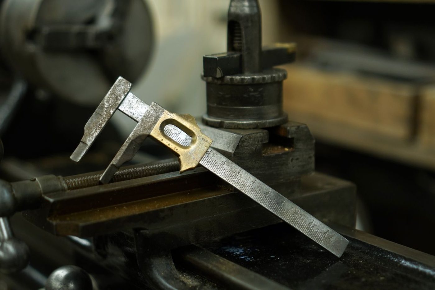 Caliper and tooling on a machine bed