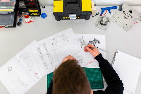 Engineer reviewing an aluminium component drawing